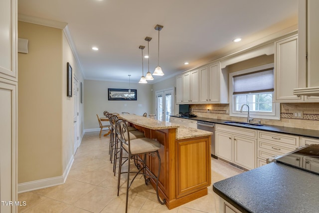 kitchen featuring backsplash, stainless steel dishwasher, sink, pendant lighting, and a center island