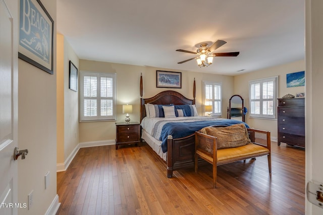 bedroom with ceiling fan and light hardwood / wood-style flooring