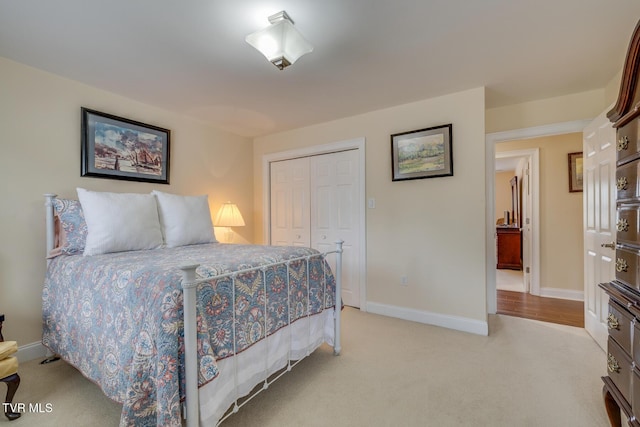 carpeted bedroom with a closet