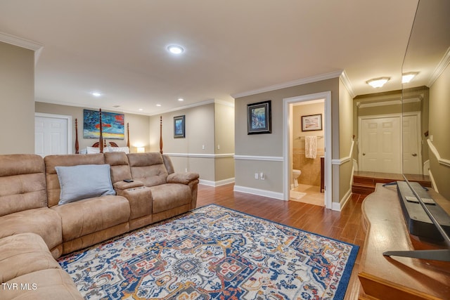 living room with hardwood / wood-style flooring and ornamental molding