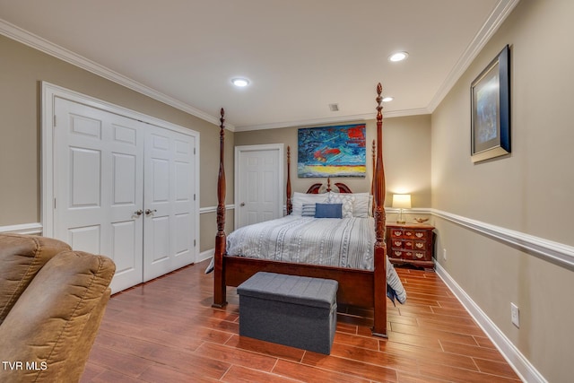 bedroom featuring hardwood / wood-style floors and ornamental molding