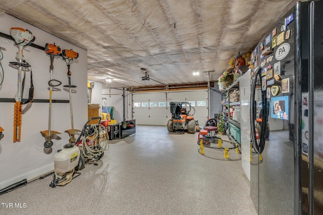 garage with black fridge