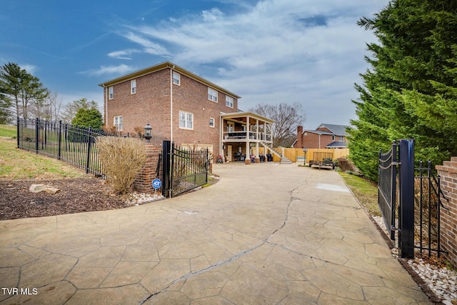 rear view of house featuring a wooden deck