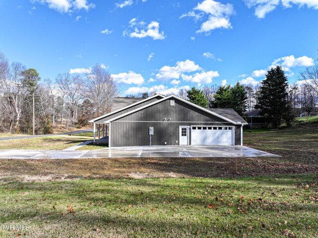 garage featuring a yard