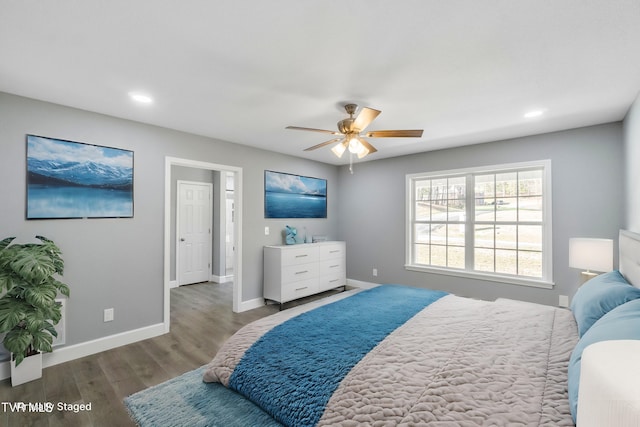 bedroom with wood-type flooring and ceiling fan