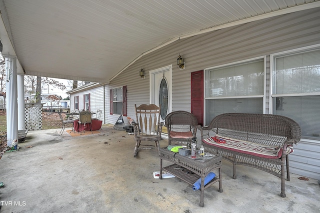 view of patio / terrace with an outdoor living space and a porch