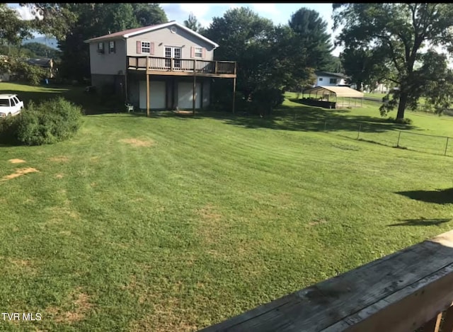 view of yard with a wooden deck