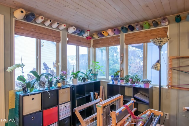 sunroom / solarium featuring wooden ceiling