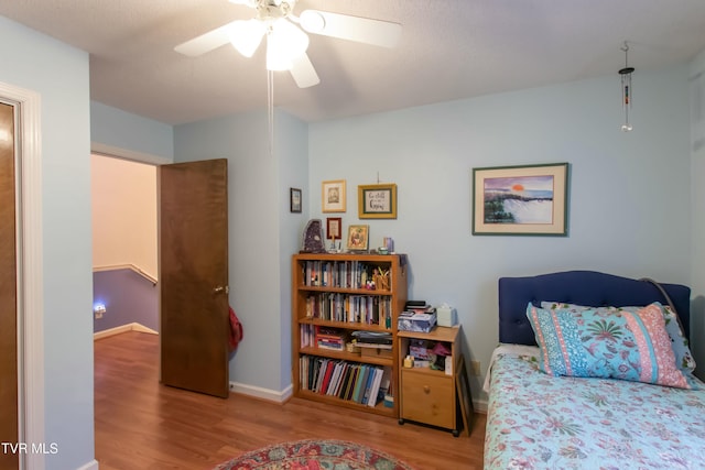 bedroom featuring light hardwood / wood-style floors and ceiling fan