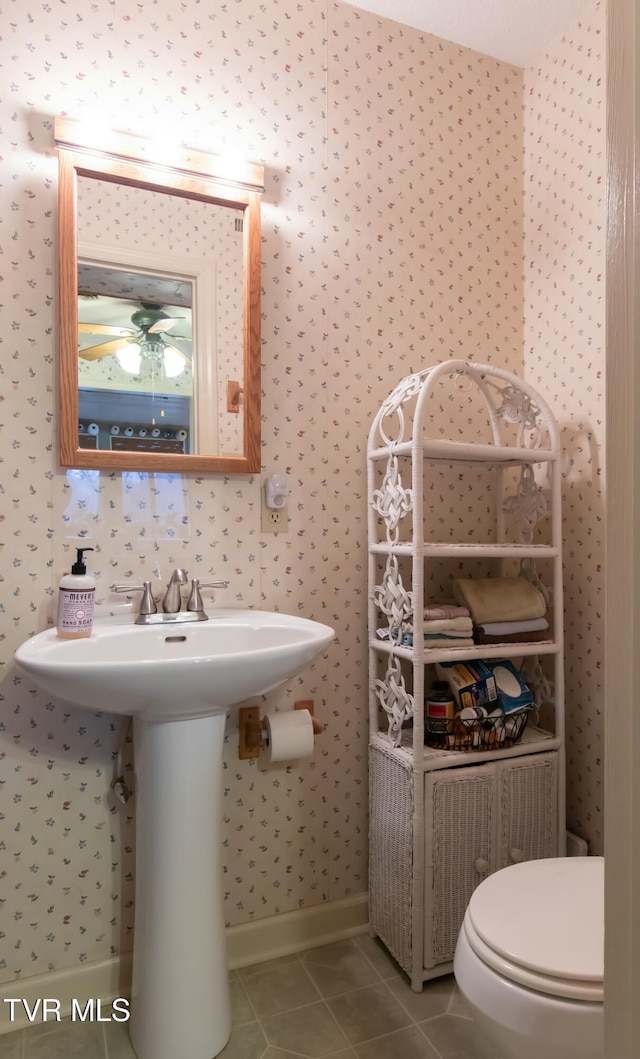 bathroom with tile patterned floors, sink, and toilet