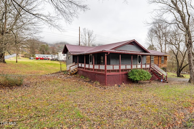 rear view of property with a yard