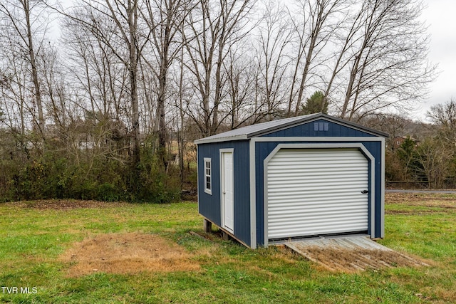 view of outbuilding featuring a yard