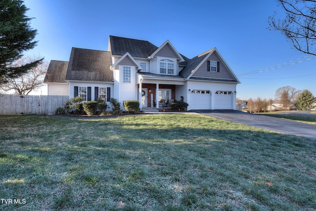 view of front of house with a front lawn and a garage