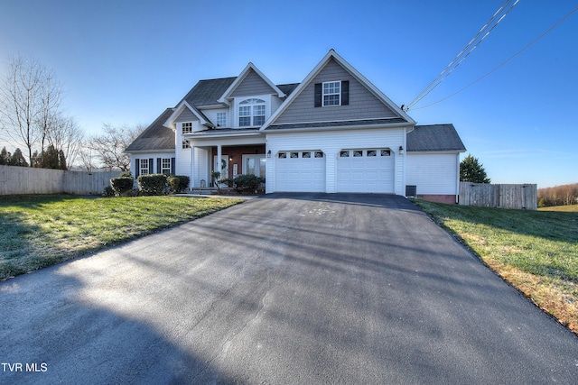 view of front facade featuring a front yard and a garage