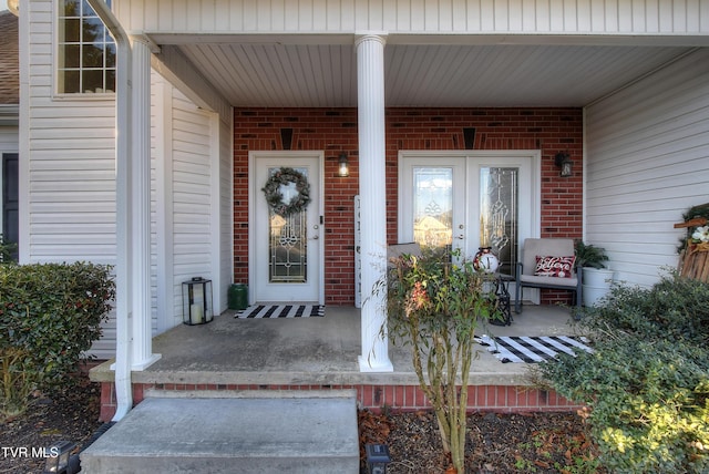 doorway to property featuring covered porch