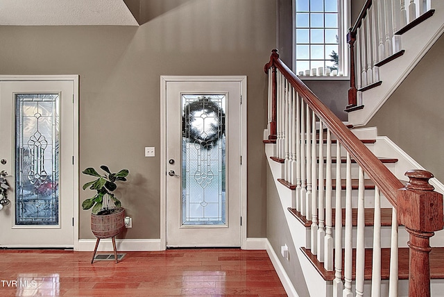 entrance foyer featuring a textured ceiling and hardwood / wood-style flooring