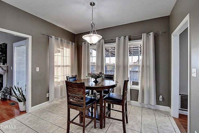 dining space with light tile patterned flooring