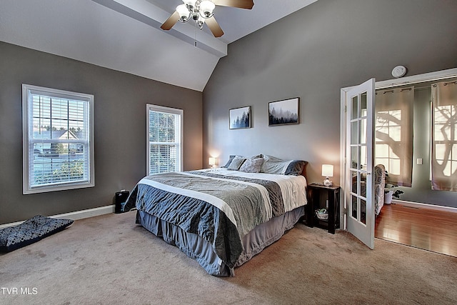 carpeted bedroom featuring ceiling fan and lofted ceiling