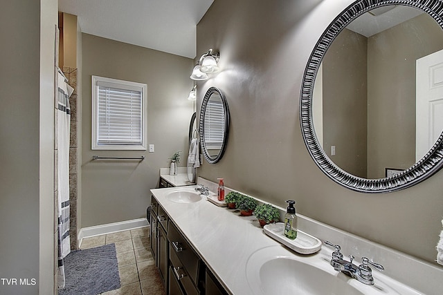 bathroom with tile patterned flooring, a shower with curtain, and vanity