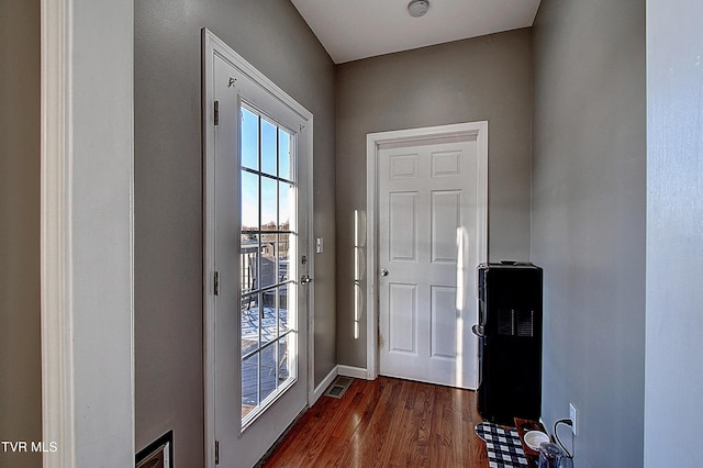 doorway to outside with dark hardwood / wood-style flooring