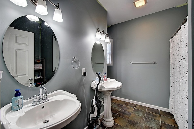 bathroom with a shower with curtain and sink