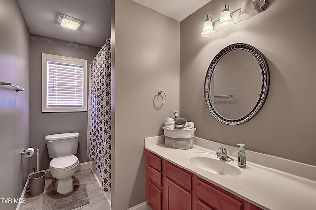 bathroom featuring tile patterned floors, vanity, toilet, and curtained shower