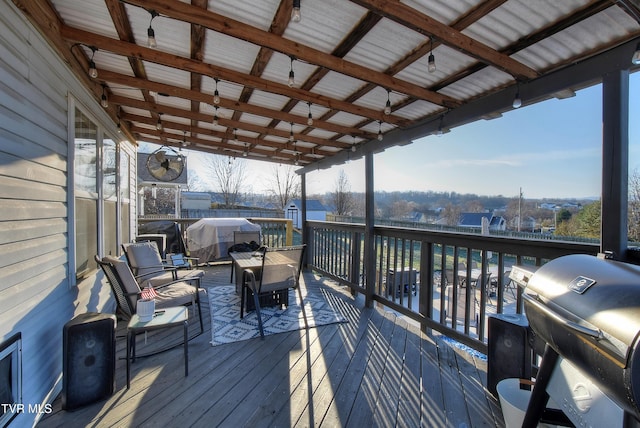 wooden terrace with a grill