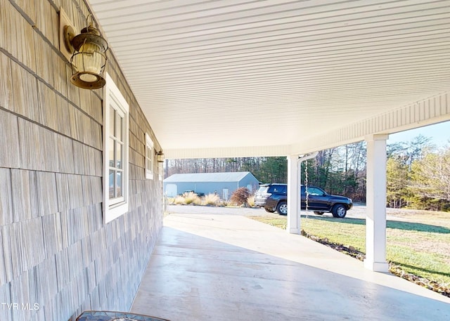 view of patio / terrace with a carport