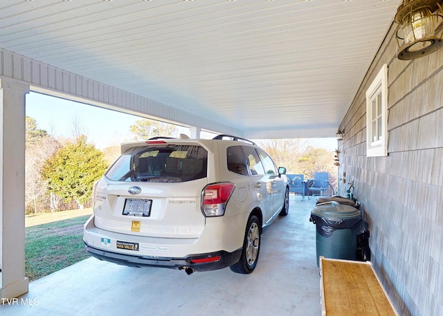 view of parking / parking lot with a carport