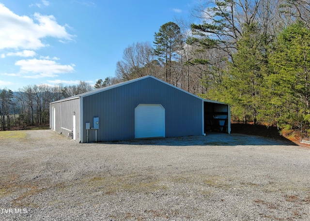 view of pole building with driveway