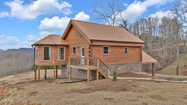 back of house featuring a mountain view