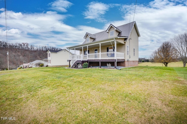 view of front facade featuring covered porch and a front lawn