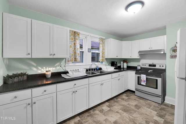 kitchen featuring sink, white refrigerator, a textured ceiling, electric stove, and white cabinets