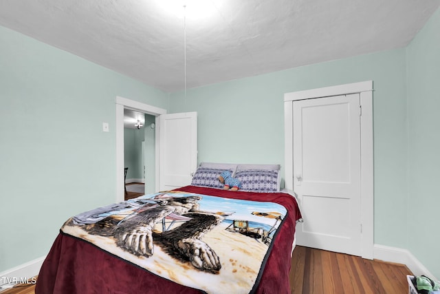 bedroom featuring hardwood / wood-style flooring