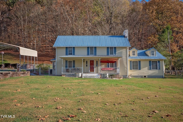 view of front of house with covered porch, metal roof, a chimney, and a front lawn