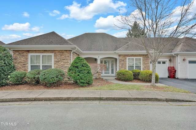 view of front of house with french doors and a garage