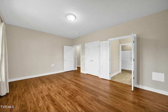 unfurnished bedroom featuring hardwood / wood-style floors