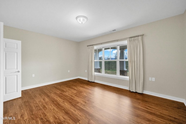 empty room featuring hardwood / wood-style floors