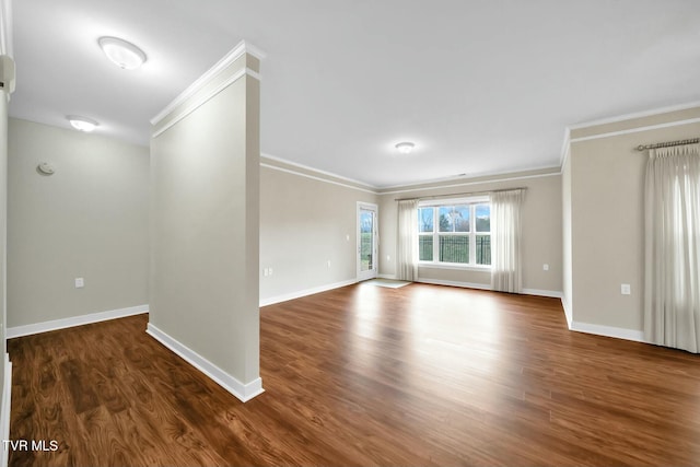 unfurnished room featuring dark hardwood / wood-style flooring and ornamental molding