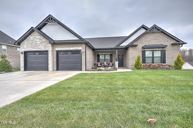 craftsman-style house featuring a garage and a front lawn