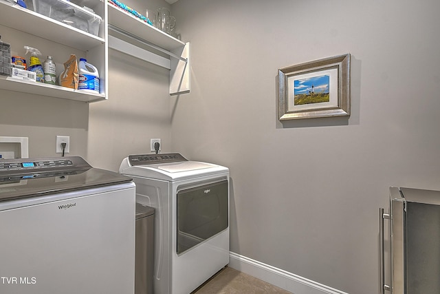 laundry room featuring separate washer and dryer