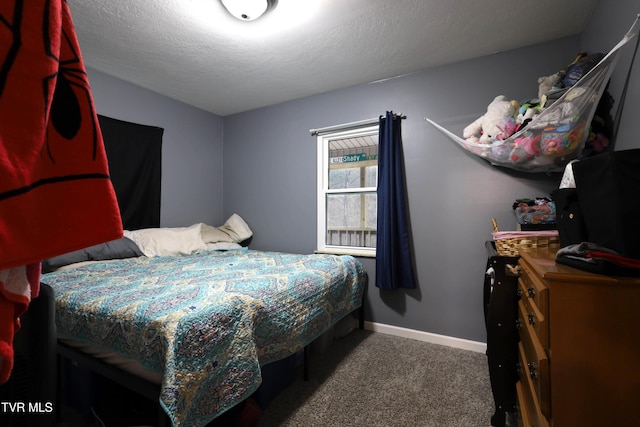 carpeted bedroom with a textured ceiling