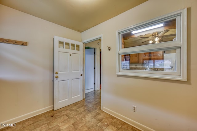 spare room with ceiling fan