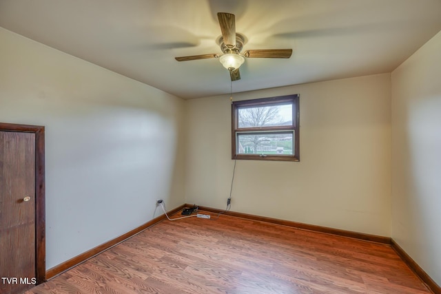 unfurnished room with ceiling fan and wood-type flooring