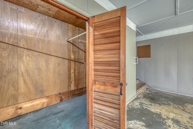 interior details with wooden walls and concrete floors