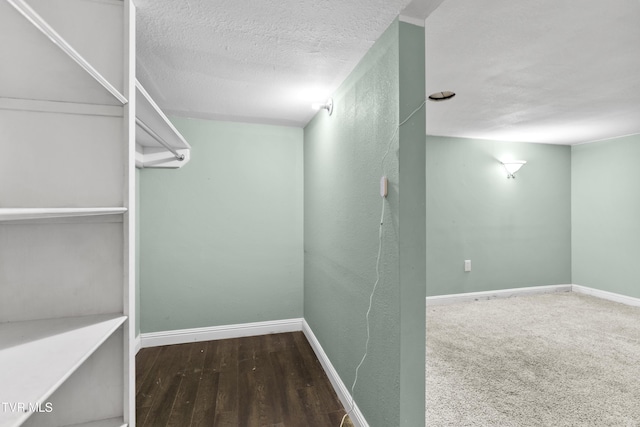 spacious closet featuring hardwood / wood-style flooring