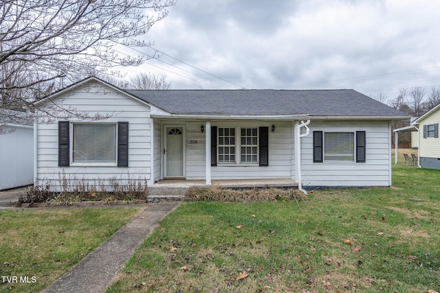 ranch-style home featuring a front lawn and a porch