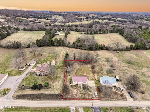 aerial view at dusk with a rural view