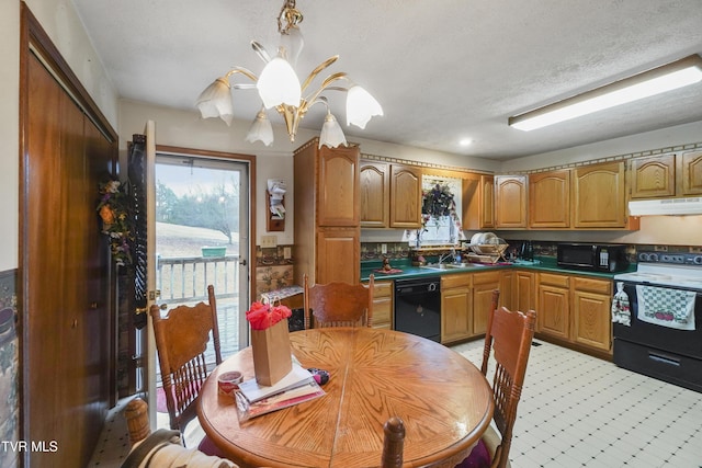 kitchen with a textured ceiling, sink, black appliances, decorative light fixtures, and a chandelier