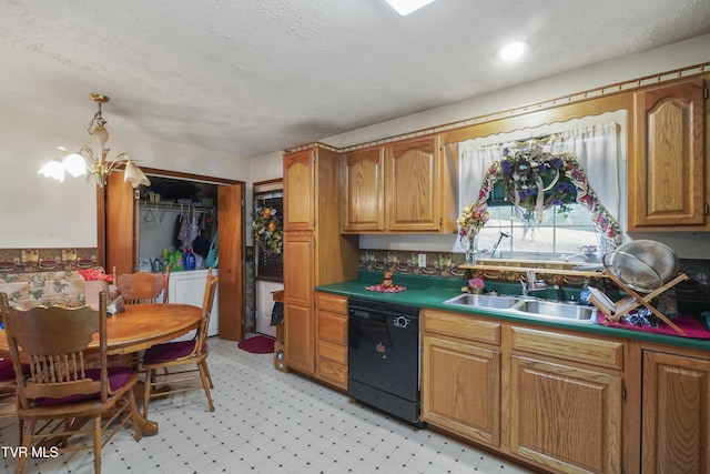 kitchen featuring a textured ceiling, sink, black dishwasher, and a chandelier